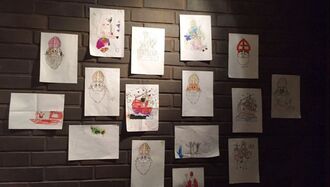 Children's drawings of St Nicholas on a wall