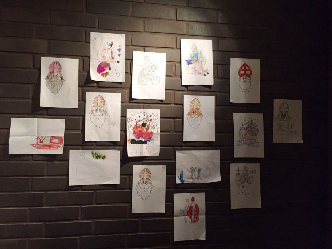 Children's drawings of St Nicholas on a wall